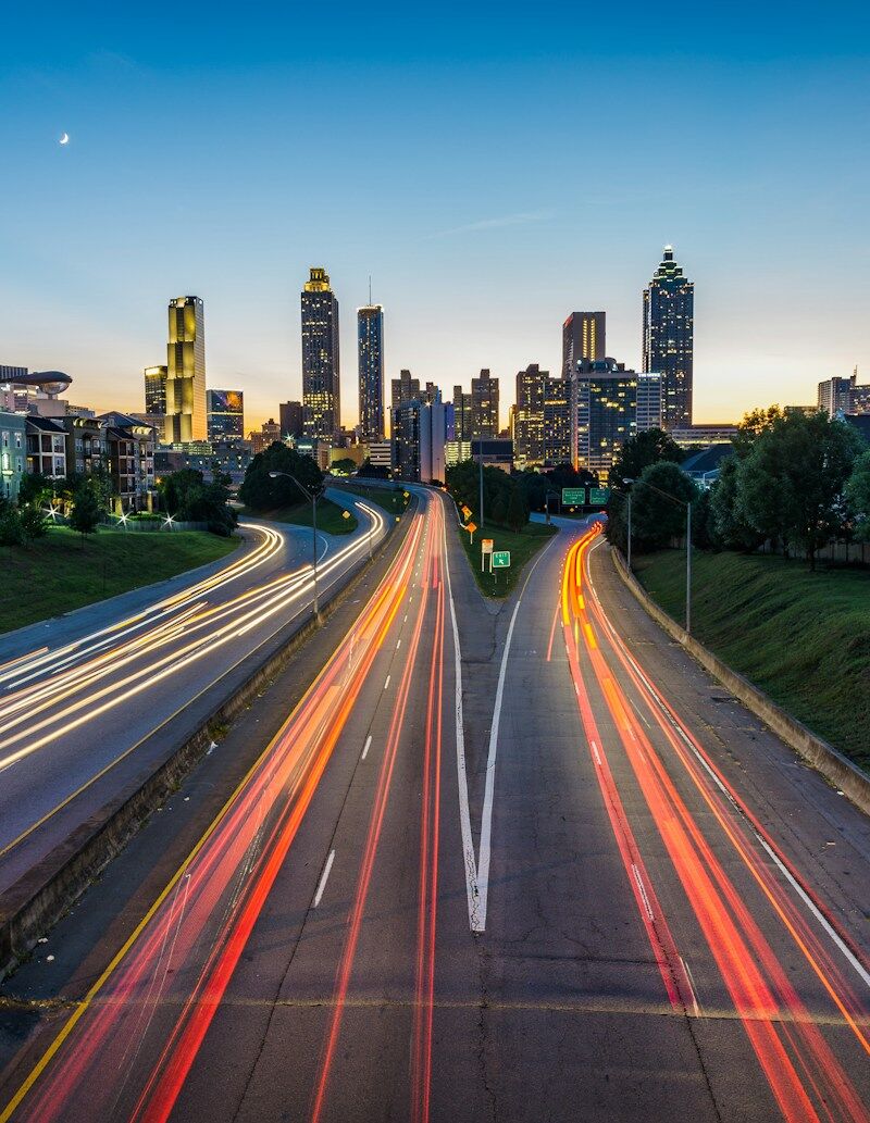 timelapse photo of highway during golden hour