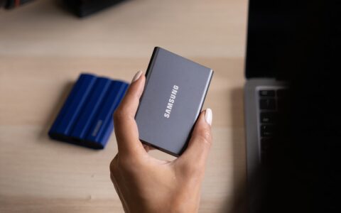 a hand holding a phone