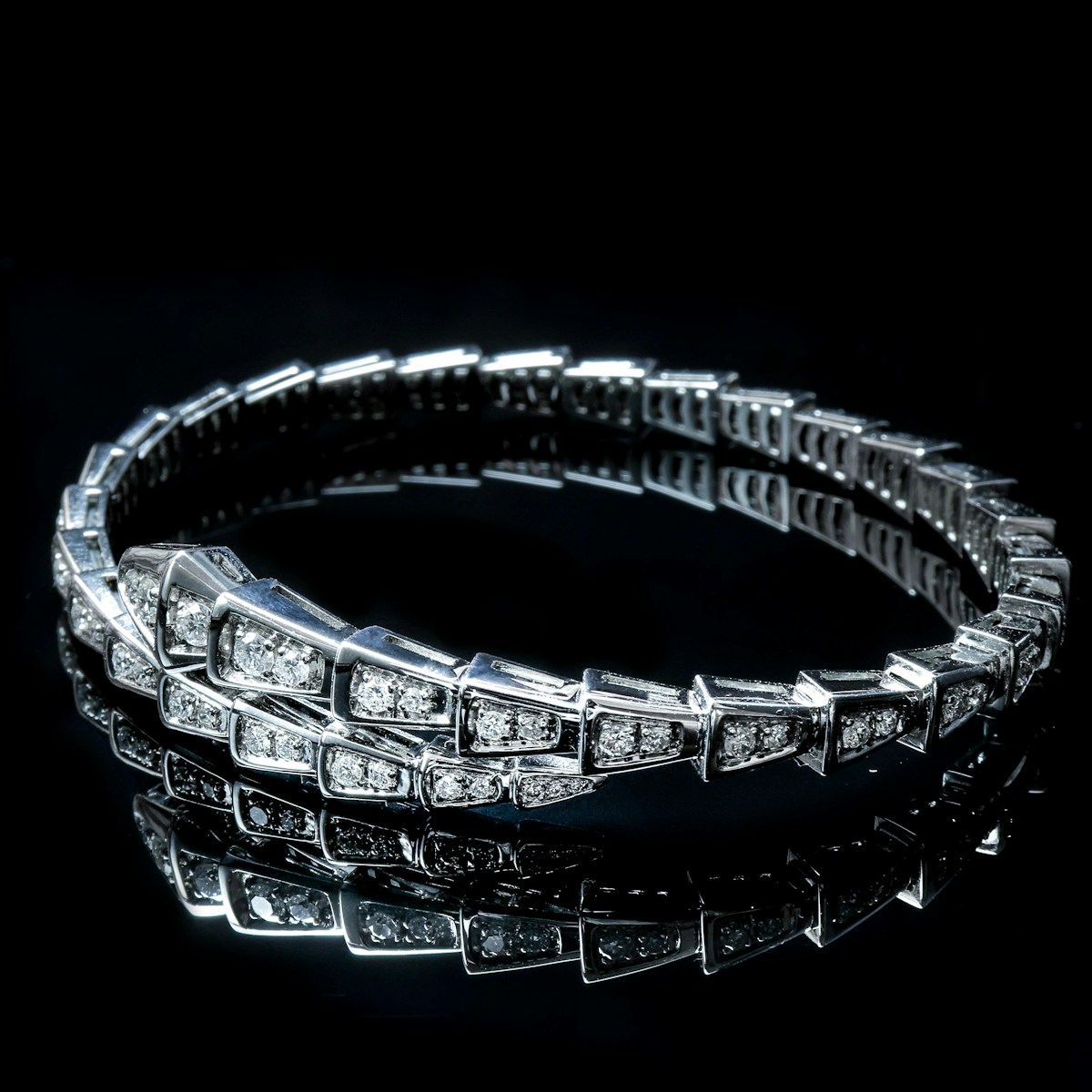 a diamond bracelet on a black background
