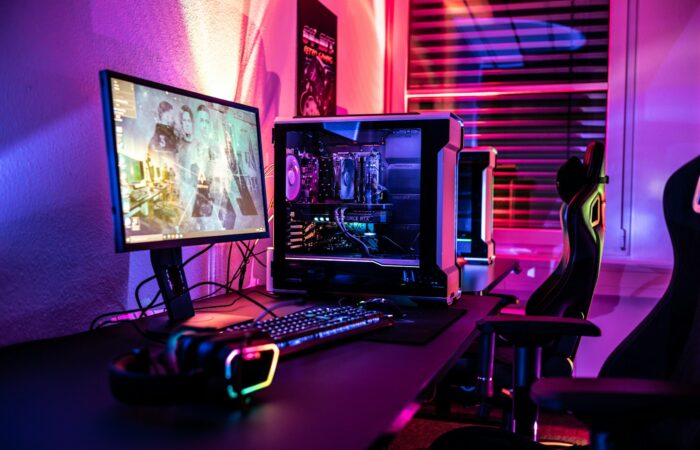 a computer desk with a monitor, keyboard and mouse